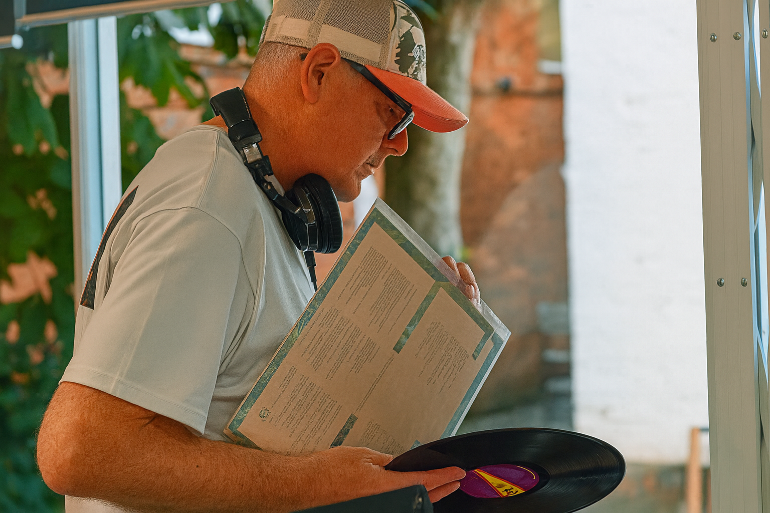 DJ playing records with headphones on. 